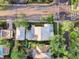 Aerial view of a property with a distinctive architectural style, a serene pool, and lush landscaping at 701 S Boulevard, Tampa, FL 33606
