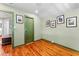 Bright room with wood floors, a green door, and natural light at 701 S Boulevard, Tampa, FL 33606