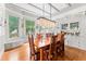 Elegant dining room with a chandelier, hardwood floors, and decorative windows at 701 S Boulevard, Tampa, FL 33606