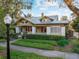 Charming yellow home with a well maintained yard, and a metal roof at 701 S Boulevard, Tampa, FL 33606