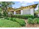 Charming home featuring well-manicured landscaping and a classic covered porch at 701 S Boulevard, Tampa, FL 33606