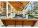 Inviting front porch with wooden porch swing and decorative ceiling fans at 701 S Boulevard, Tampa, FL 33606