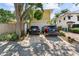 Spacious two-car garage with ample parking space and an adjacent home at 701 S Boulevard, Tampa, FL 33606