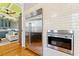 Modern kitchen features stainless steel appliances, white tiled walls, and an open design concept at 701 S Boulevard, Tampa, FL 33606