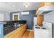Kitchen with stainless sink, wood cabinets, and white appliances at 701 S Boulevard, Tampa, FL 33606