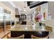 Kitchen features stainless steel appliances, granite countertops, large island, and hardwood floors at 701 S Boulevard, Tampa, FL 33606
