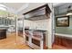 Kitchen features stainless steel appliances, hardwood floors, granite countertops and a chef's range at 701 S Boulevard, Tampa, FL 33606