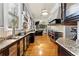 Gourmet kitchen boasts hardwood floors, granite countertops, stainless steel appliances, and a spacious layout at 701 S Boulevard, Tampa, FL 33606