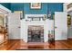 Elegant living room with a beautiful fireplace, white trim and warm wood floors at 701 S Boulevard, Tampa, FL 33606