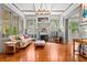 Bright living room featuring hardwood floors, fireplace, and comfortable seating at 701 S Boulevard, Tampa, FL 33606