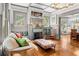 Bright living room featuring a fireplace, hardwood floors, and cozy seating at 701 S Boulevard, Tampa, FL 33606