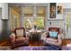 Inviting living room with comfortable armchairs, hardwood floors, and natural light at 701 S Boulevard, Tampa, FL 33606