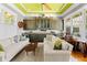 Cozy living area with custom cabinets, stylish decor, and ample natural light from large windows at 701 S Boulevard, Tampa, FL 33606