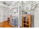 Living room with floral wallpaper, fireplace with leaded glass screen and hardwood floors at 701 S Boulevard, Tampa, FL 33606