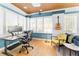 Bright home office with modern desk, blue walls, and lots of natural light at 701 S Boulevard, Tampa, FL 33606
