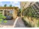 Exterior patio with comfortable seating and vertical garden wall with lush foliage at 701 S Boulevard, Tampa, FL 33606