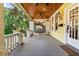 Inviting covered porch with ceiling fans and a swing for relaxing at 701 S Boulevard, Tampa, FL 33606