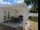 Covered back patio with seating and a grill for outdoor enjoyment at 7202 8Th N Ave, St Petersburg, FL 33710