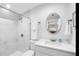 Modern bathroom featuring white marble, updated fixtures, and a walk-in shower is neat and bright at 7202 8Th N Ave, St Petersburg, FL 33710