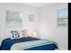 Bright bedroom featuring star fish pillows, blue comforter, and bedside table with a lamp at 7202 8Th N Ave, St Petersburg, FL 33710