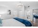 Bedroom with a chandelier, closet, and an ensuite bathroom is flooded with natural light at 7202 8Th N Ave, St Petersburg, FL 33710