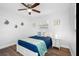 Bedroom with a ceiling fan, coastal decor, and clean lines at 7202 8Th N Ave, St Petersburg, FL 33710