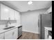 Bright kitchen with stainless steel appliances, white cabinets, sleek countertops, and ample storage at 7202 8Th N Ave, St Petersburg, FL 33710