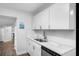 Bright, modern kitchen featuring marble countertops, stainless steel appliances and white cabinets at 7202 8Th N Ave, St Petersburg, FL 33710