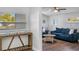 Inviting living room with hardwood floors, neutral walls, lots of light, and comfortable blue sofas at 7202 8Th N Ave, St Petersburg, FL 33710