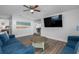 Spacious living room features an open floor plan with hardwood floors, comfortable seating, and wall-mounted TV at 7202 8Th N Ave, St Petersburg, FL 33710