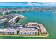 An aerial view of waterfront community with lush landscaping and beautiful water views at 7645 Sun Island S Dr # 204, South Pasadena, FL 33707