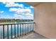 Relaxing balcony view overlooking the water and waterfront residences at 7645 Sun Island S Dr # 204, South Pasadena, FL 33707