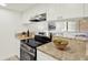 The kitchen features stainless steel appliances, granite counters and a breakfast bar at 7645 Sun Island S Dr # 204, South Pasadena, FL 33707
