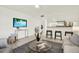 The open living room flows into the kitchen, and features modern decor and comfortable seating at 7645 Sun Island S Dr # 204, South Pasadena, FL 33707