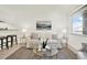 Inviting living room featuring a comfortable couch, accent tables, and plenty of natural light at 7645 Sun Island S Dr # 204, South Pasadena, FL 33707