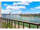 Waterfront views from balcony looking out onto the calm waters and city skyline at 7645 Sun Island S Dr # 204, South Pasadena, FL 33707
