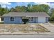 Charming single-story home featuring a well-maintained lawn and a one-car garage at 7736 Seashore Dr, Port Richey, FL 34668