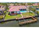 Waterfront home with a boat dock and lift, pool, and patio for entertaining at 9807 Bay Island Dr, Tampa, FL 33615