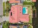 Waterfront property with swimming pool, boat dock, and red tile roof at 9807 Bay Island Dr, Tampa, FL 33615