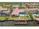 Waterfront home with dock, pool, patio, and lush landscaping at 9807 Bay Island Dr, Tampa, FL 33615