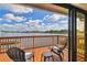 Relaxing balcony with seating area and a beautiful view of the water and neighborhood at 9807 Bay Island Dr, Tampa, FL 33615