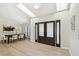Light and airy foyer with high ceilings, skylights, and a dining area with a modern chandelier at 9807 Bay Island Dr, Tampa, FL 33615