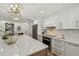 Well-appointed kitchen featuring granite countertops, stainless appliances, and a center island at 9807 Bay Island Dr, Tampa, FL 33615