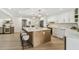 Gorgeous kitchen island with seating, stainless appliances, white cabinets, and ample counter space at 9807 Bay Island Dr, Tampa, FL 33615