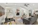 Inviting living room with a vaulted ceiling, a fireplace, and comfortable furniture at 9807 Bay Island Dr, Tampa, FL 33615