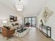 Inviting living room featuring hardwood floors and sliding glass doors with water view at 9807 Bay Island Dr, Tampa, FL 33615