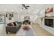 Open-concept living room with fireplace and pool access at 9807 Bay Island Dr, Tampa, FL 33615