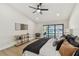 Relaxing primary bedroom with a ceiling fan, access to the pool, and modern decor at 9807 Bay Island Dr, Tampa, FL 33615