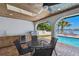 Charming outdoor kitchen with grill, countertop and sink, perfect for alfresco dining by the pool at 9807 Bay Island Dr, Tampa, FL 33615