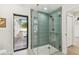 Bathroom shower featuring designer tile and a glass door with a view of the outdoor pool area at 9807 Bay Island Dr, Tampa, FL 33615